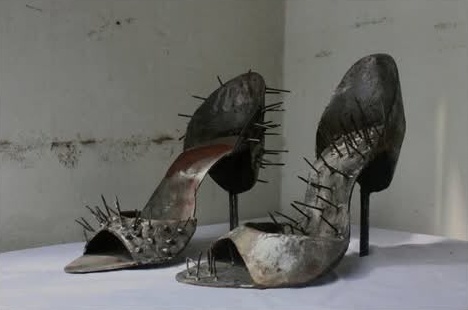 Pair of spiked steel stiletto sculptures
